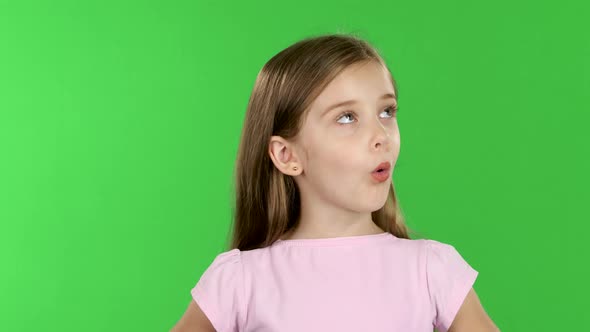 Child Looks with Great Surprise Around. Green Screen alt