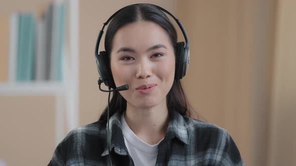 Close Up Portrait Web Cam View Asian Business Woman Wears Headset Talks to Camera Making Distance alt