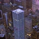 Helicopter Aerial Shot of Modern Skyscraper Buildings in Urban City Metropolis at Night - VideoHive Item for Sale