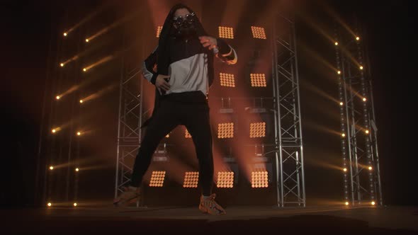 Breakdance Concept. Trendy Young Man Dancing Single in Club, Neon Light, Lots of Smoke. Fashion alt