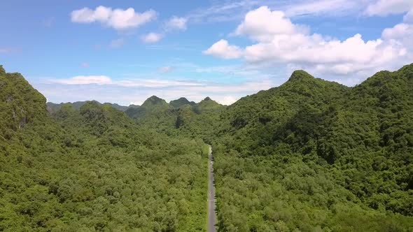 Aerial View Modern Road Vanishes Into Space Among Hills alt
