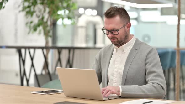 Thumbs Up By Positive Creative Man Working alt