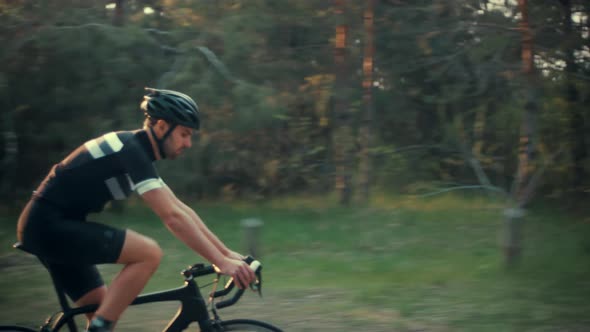 Cyclist Training Leisure Twists Pedals On Triathlon Bicycle. Gear System  And Bike Wheel. Workout. alt