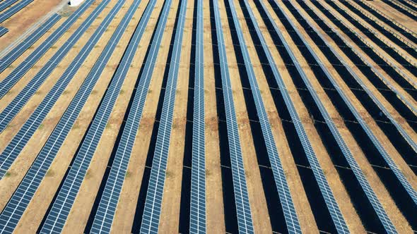 Top View of a Large Solar Power Station Located in a Field alt