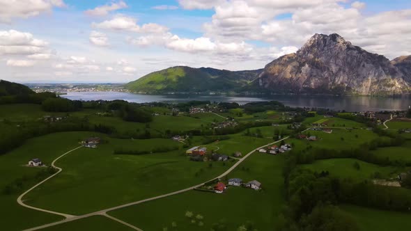 Beautiful view on the Mountains, lake and a Village Drone Video alt