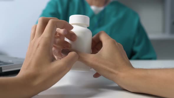 Doctor Giving Female Bottle With Antidepressants, Patient POV, Medication