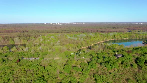 Flight around hill in Oberwald recreation area near Frankfurt in Germany alt