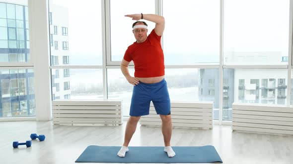 Young Funny Fat Sporty Man Stretching Before Exercise, Stock Footage