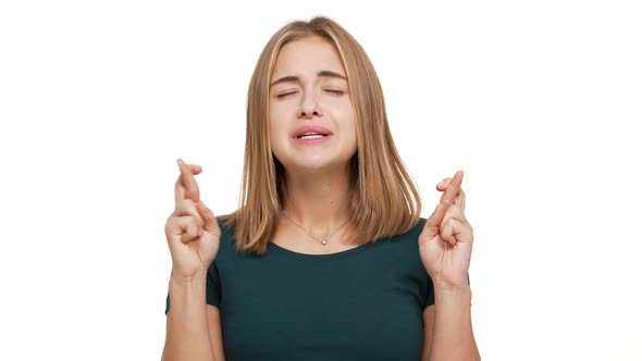 Portrait of Concentrated Woman Dressed in Green Shirt Willing Good Luck Pleading with Keeping alt