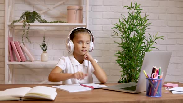 Little Child Girl Using Laptop Computer for Studying Online E-learning System