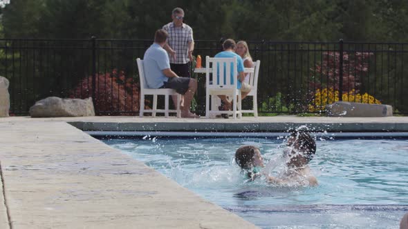 Young girl jumps to father in pool