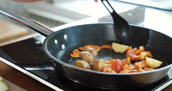 Mixing Frying Vegetables in Pan Chef Cooking in Kitchen of Restaurant or Cafe