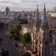 Aerial View of European City with Catholic Church and Car Traffic