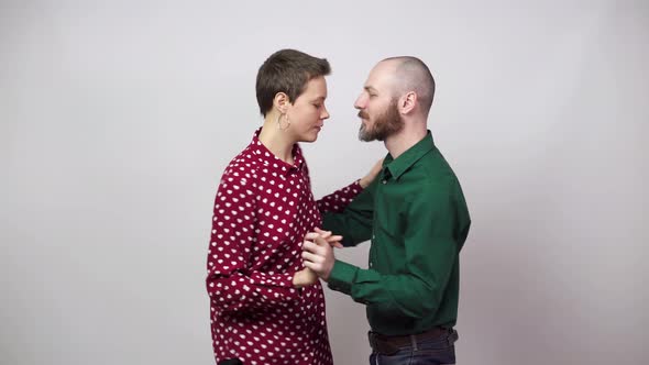 Romantic couple dancing on white background