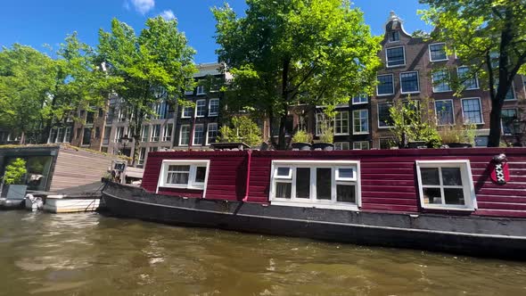 Red Boat Houses By The Amsterdam Canal