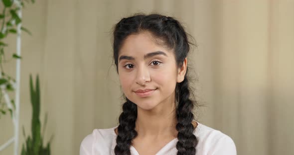 Portrait of Indian Contented Woman Looks Coquettishly Into Camera Flirts Affectionately Smiles alt