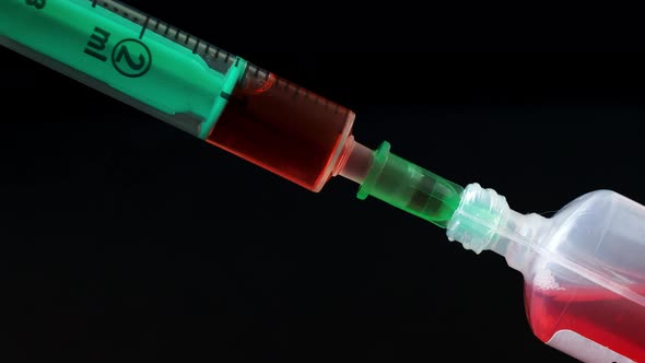 Plastic medical syringe with needle and plastic vial. Medical injection concept. 