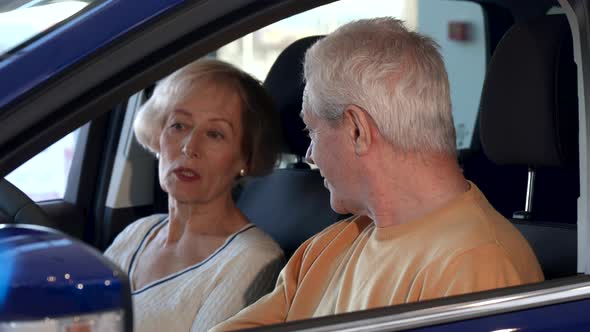 Senior Couple Talks Inside the Car