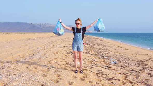 A Volunteer Collecting Garbage on the Beach alt