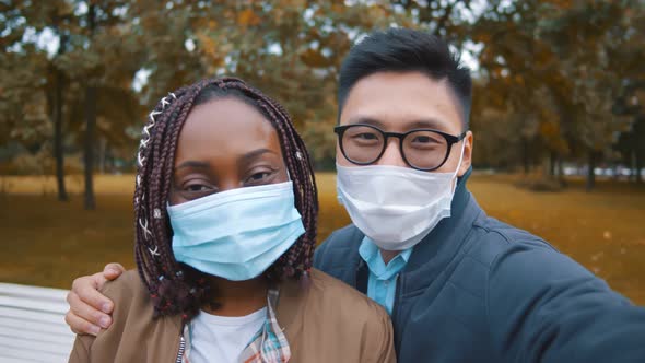 Young Diverse People Taking Selfie Outdoor Wearing Protective Face Masks alt