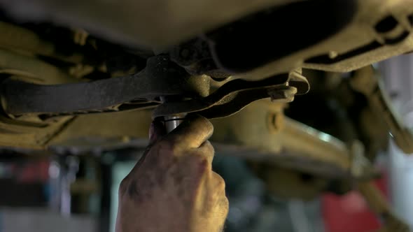 Close Up Unscrewing Nuts Using Electrical Screwdriver alt