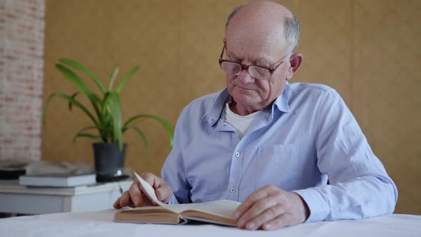 Caring for Elderly, a Small, Cute Male Child Brings Clean Clear Water To His Beloved Grandfather alt