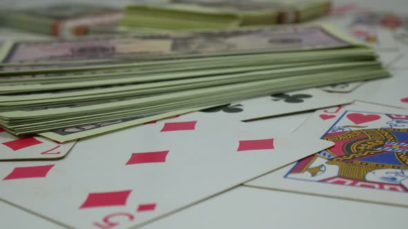 Playing Poker Cards And Dollars On The Table In The Club alt
