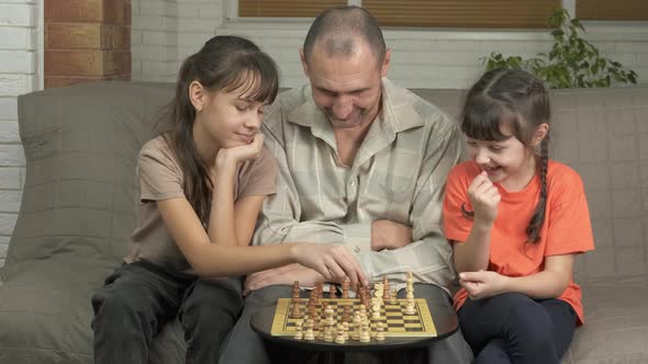 Dad with Children with Mental Chess alt