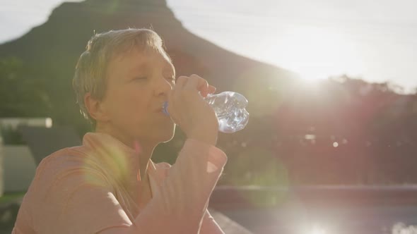 Senior woman outdoor yoga fitness alt