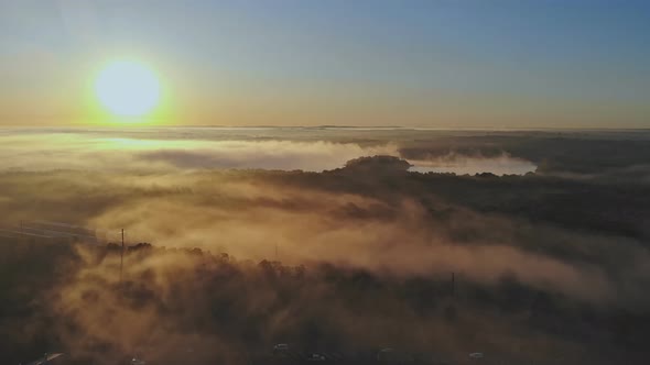 There is a Dense Fog During the Early Morning Hours in a Small Residential Neighborhood Near the alt