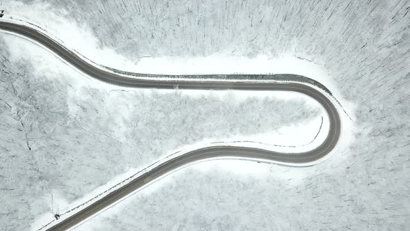 Drones Eye View  Winding Road From the High Mountain Pass in Winter alt