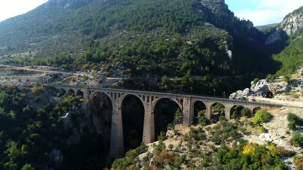 Passing Cargo Train Stone Arch Bridge alt