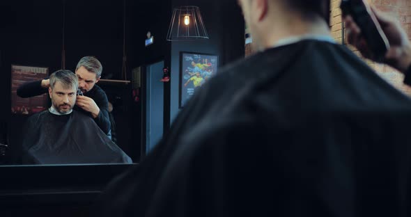 Barber Cuts Customer's Hair Machines alt