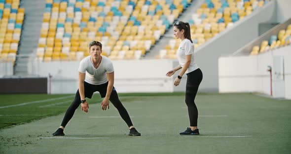 Couple Of Joggers Warming Up