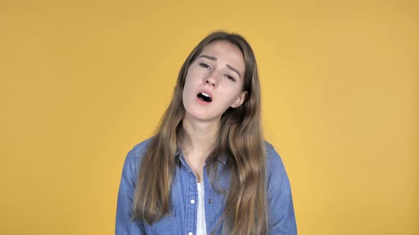 Pretty Woman Gesturing Failure and Problems Isolated on Yellow Background alt