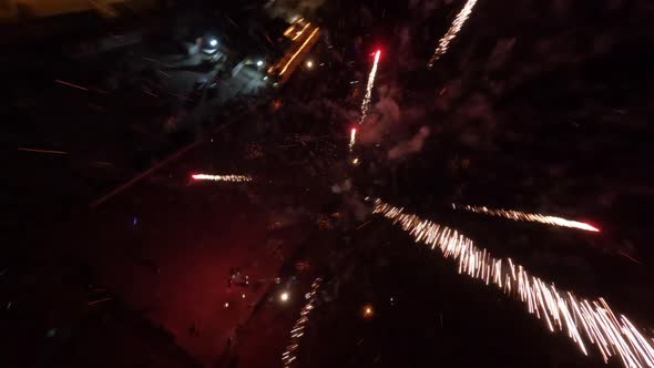 Night Fpv Drone Shot of Coastal Line During Fire Show Event alt