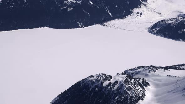 Snowscape With Forest Mountain River During Winter At Garibaldi Lake In British Columbia, Canada. - alt