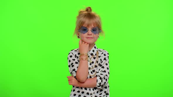Portrait of Funny Playful Blonde Child Girl in White Black Shirt Wearing Sunglasses Charming Smile alt
