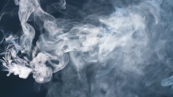 Smoke in Slow Motion. Smoke on Black. White Smoke. alt