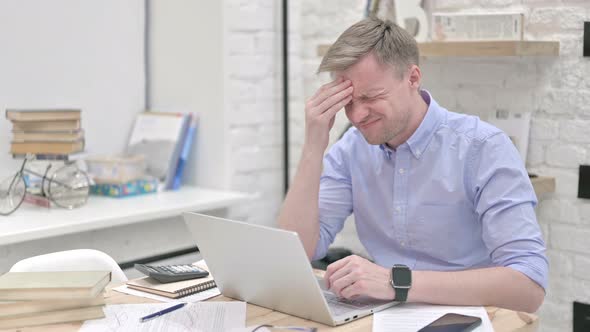 Businessman Feeling Headache While Working on Laptop alt