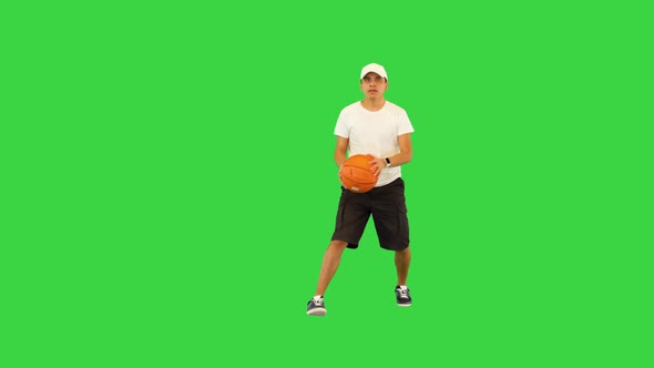 Young Basketball Player Training Before Game Throwing Ball in Basket Male Athlete Practicing Alone