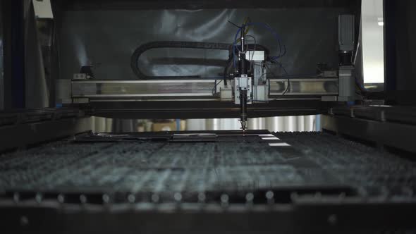 Inside of Modern Metal Cutting Machine. Automated Equipment in Work. Steel Production Plant alt