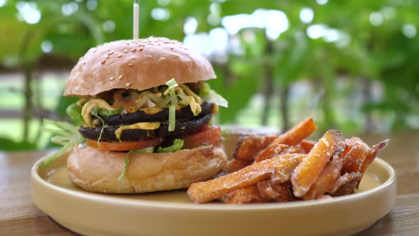 Close Up of Healthy Delicious Vegan Burger Served with Sweet Potato Fires alt