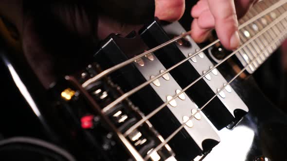 Playing A Bass Guitar alt