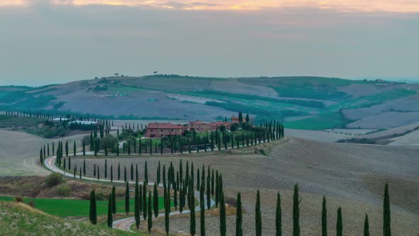 Sunrise time lapse of Tuscany landscape in Italy alt