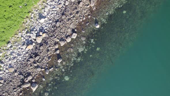 Bird's Eye View of a Rocky Coastline alt