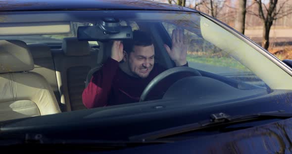 Exhausted Young Man Hitting Steering Wheel Getting Angry Having Problem alt