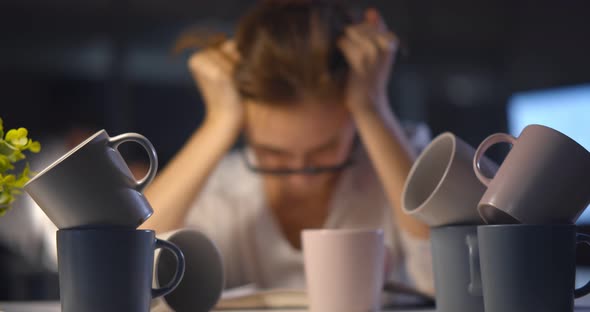 Stressed Exhausted Woman Sitting at Office Desk and Working Overtime Falling Asleep alt