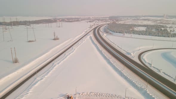 Interchange with a Road Bridge in Winter Aerial View alt