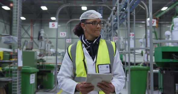 Warehouse female worker working   alt